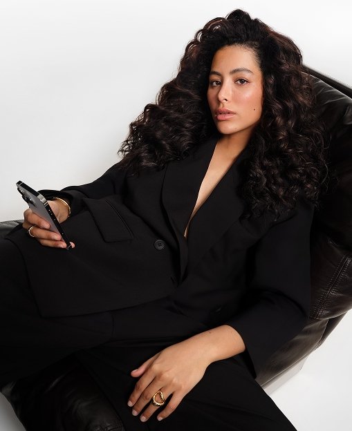 Hair Diagnosis Model seated on a couch